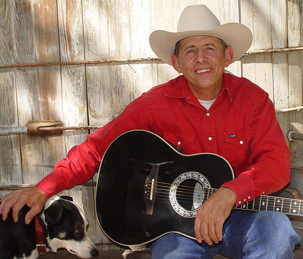 Monte with his guitar and dog